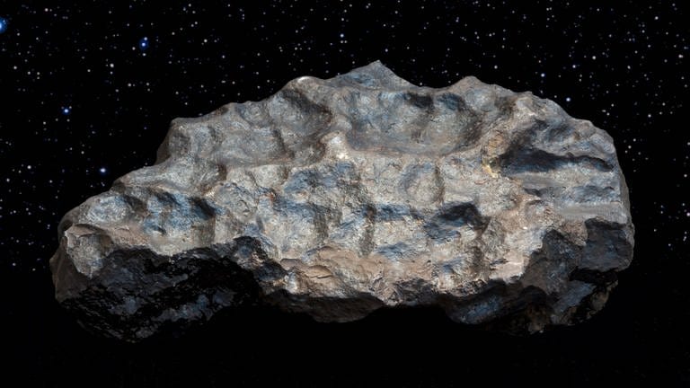 Der Meteorit von Colomera: Meteoriten sind Objekte, die aus dem Weltall kommen. Sie sind mit hoher Geschwindigkeit durch die Erdatmosphäre gesaust, etwa 70 Kilometer pro Sekunde. Meteoriten zeichnen sich meist dadurch aus, dass sie eine schwarze, glänzende Haut haben.